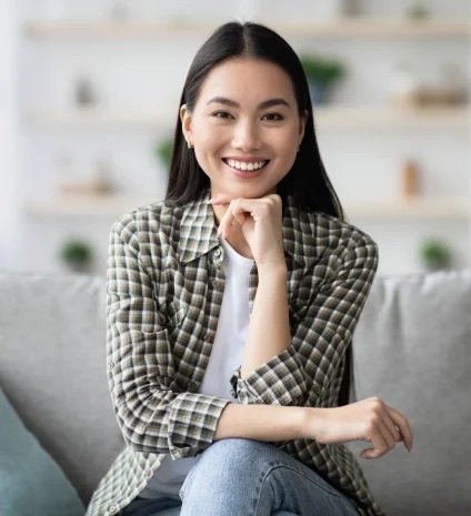 Potrait of happy asian woman sitting on sofa at ho 2022 12 16 09 12 21 utc.jpeg